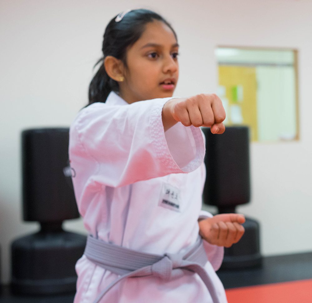 Girl learning taekwondo